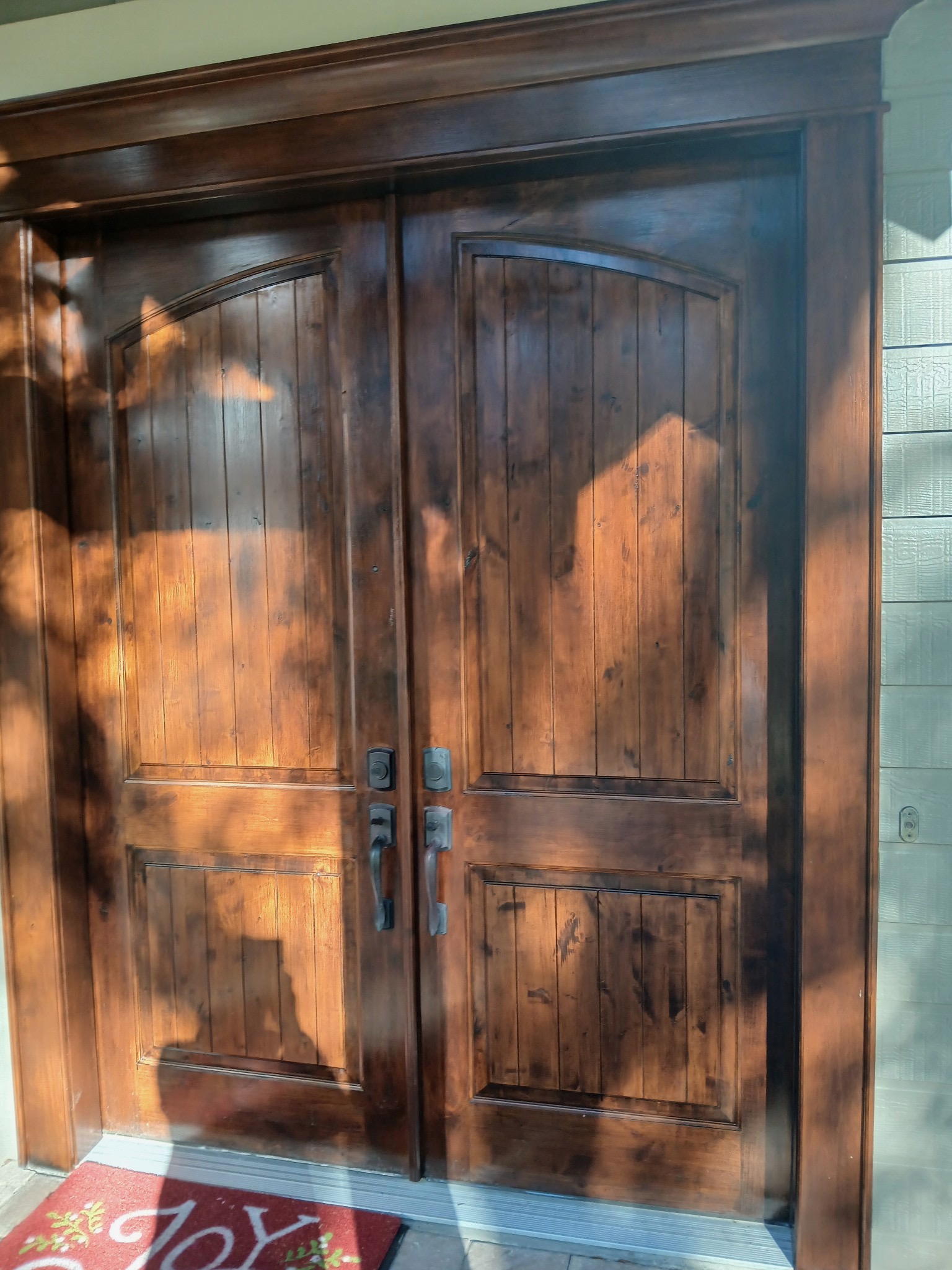 Front doors — stained & refinished by Color Pros Painting