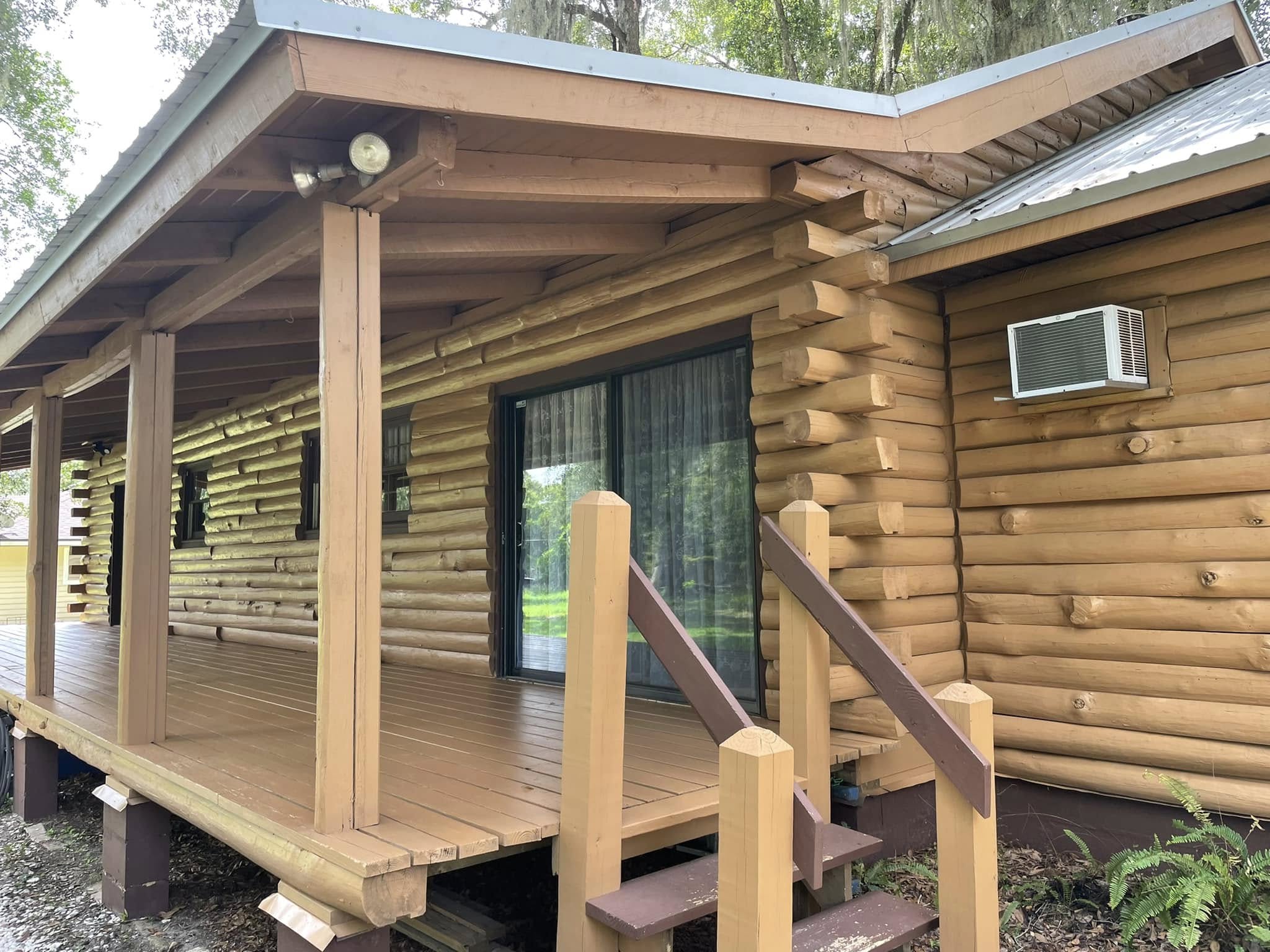 Log home — stained and sealed by Color Pros Painting