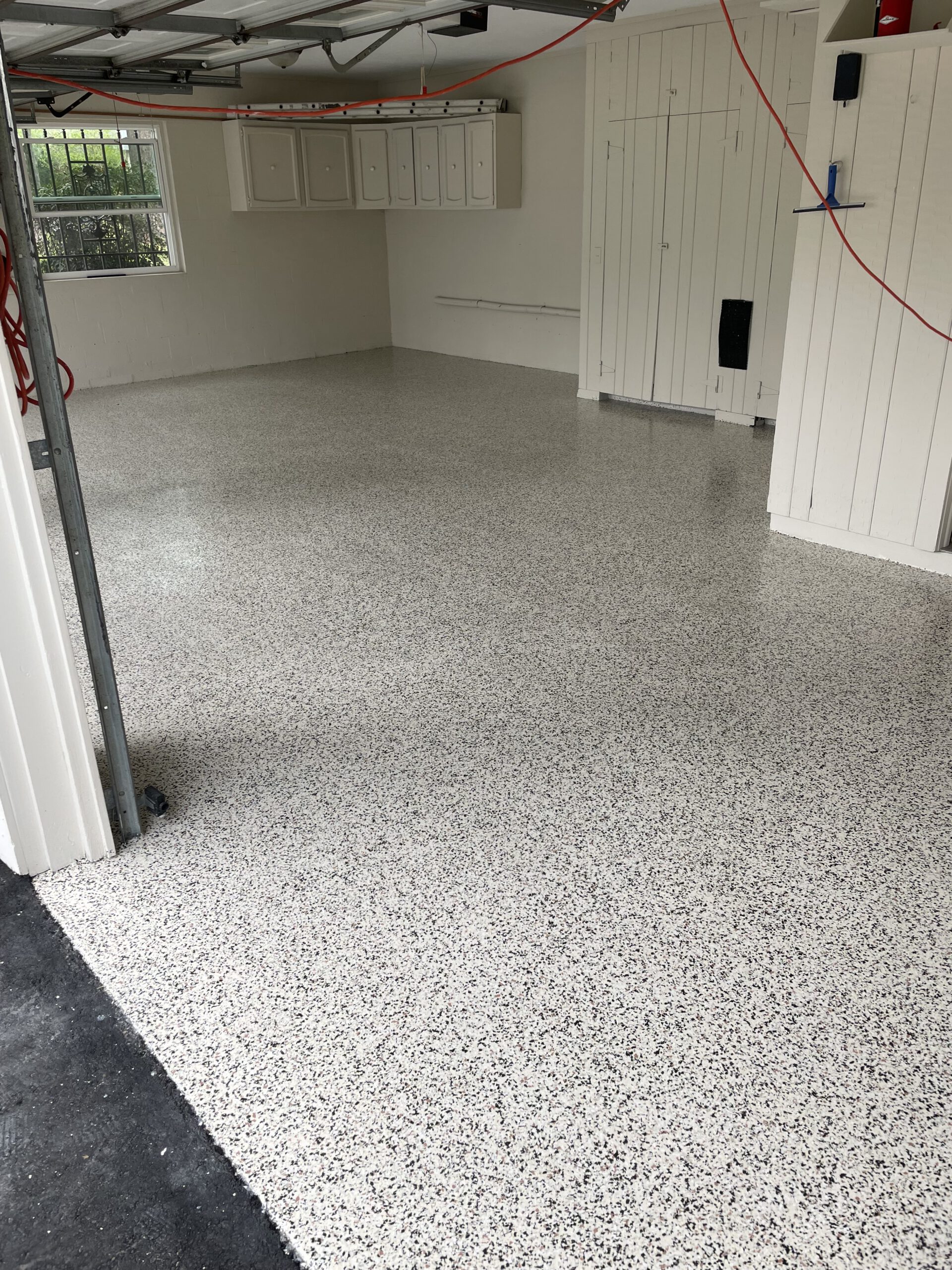 Epoxy flake close-up — sealed finish by Color Pros Painting
