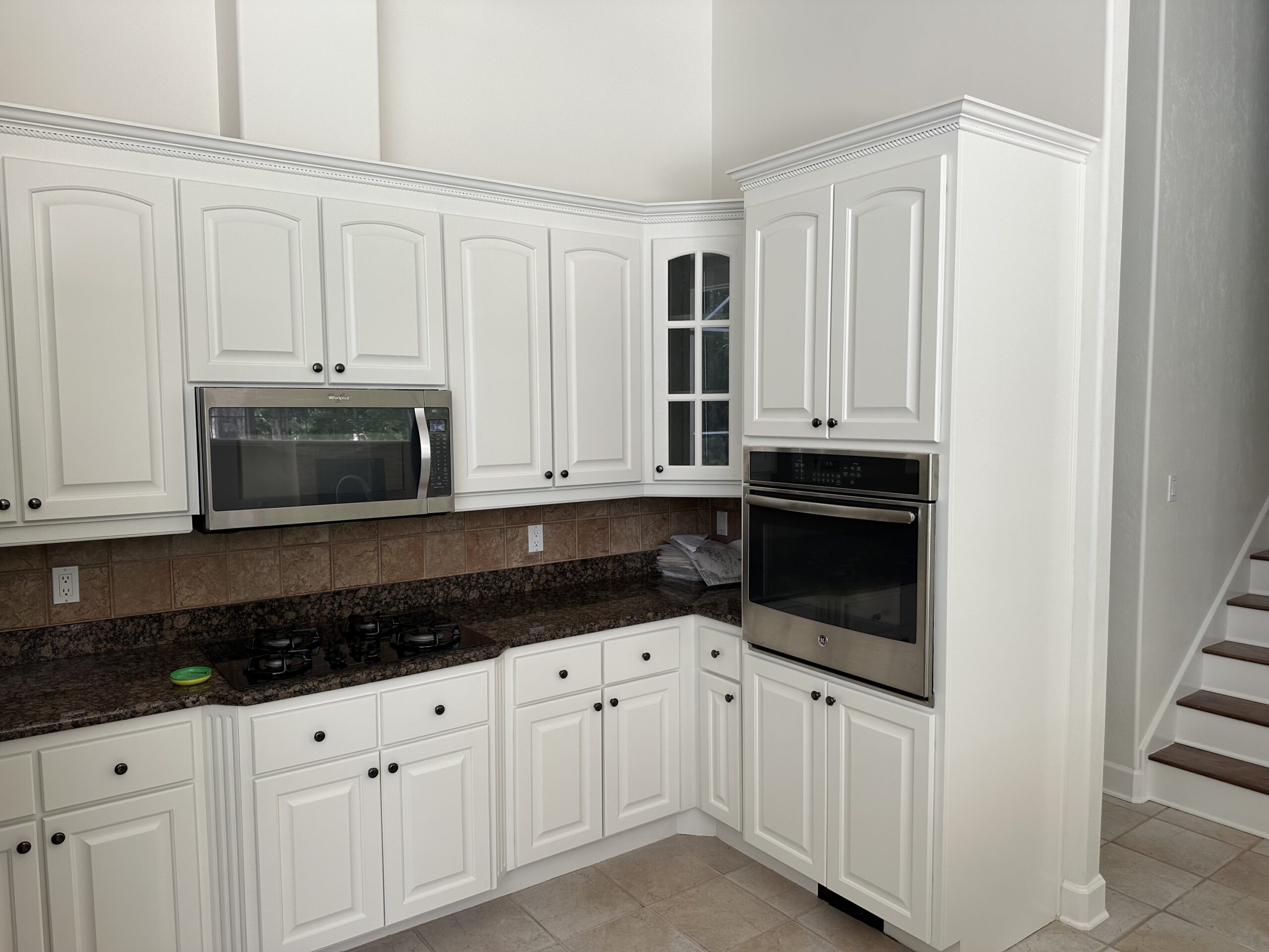 Kitchen cabinets painted bright white
