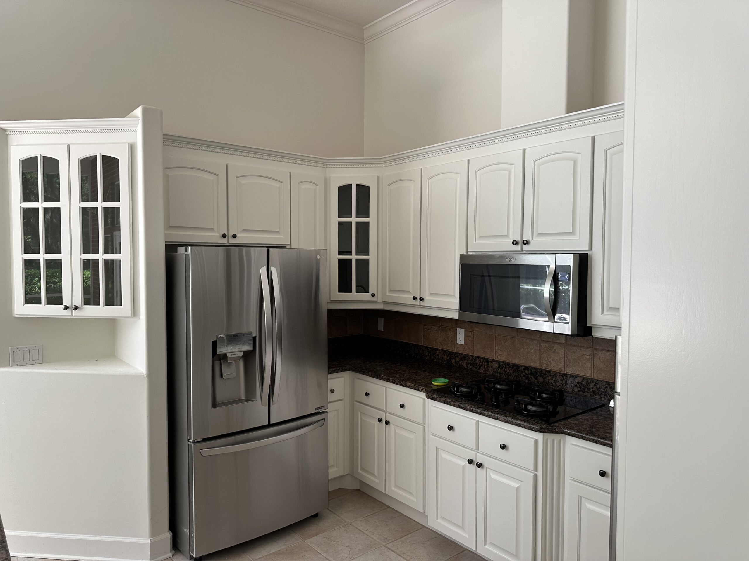 Crisp white kitchen refresh by Color Pros Painting