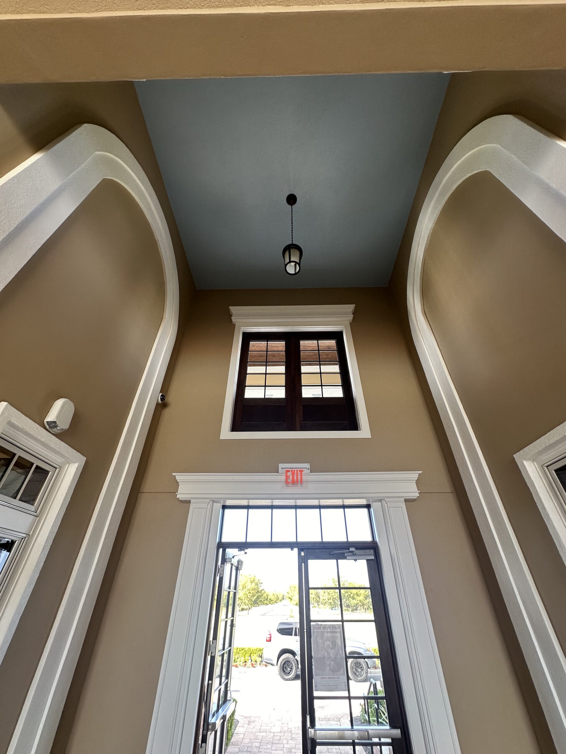 Two-story foyer & window trim by Color Pros Painting