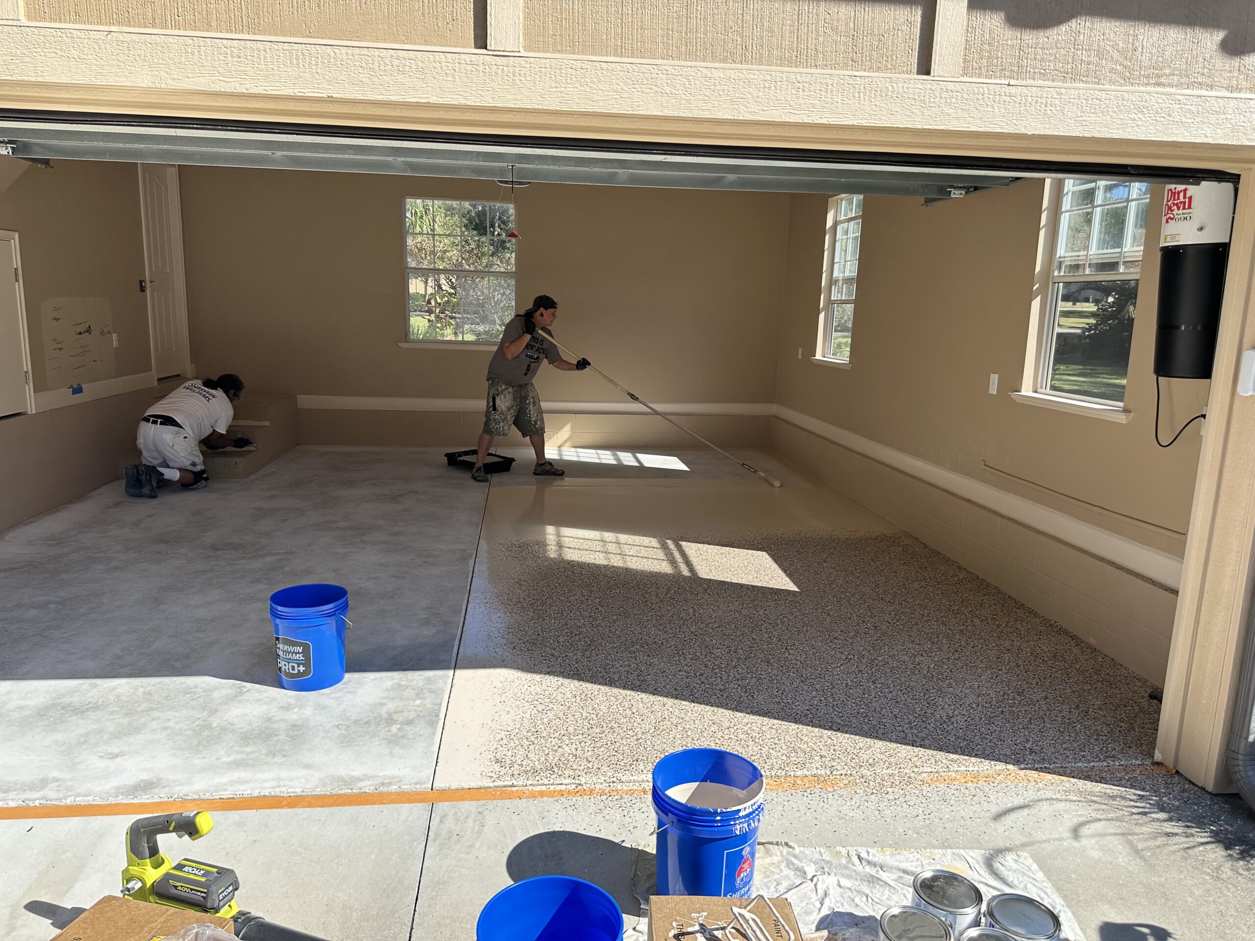 Color Pros crew coating a garage floor in Gainesville FL