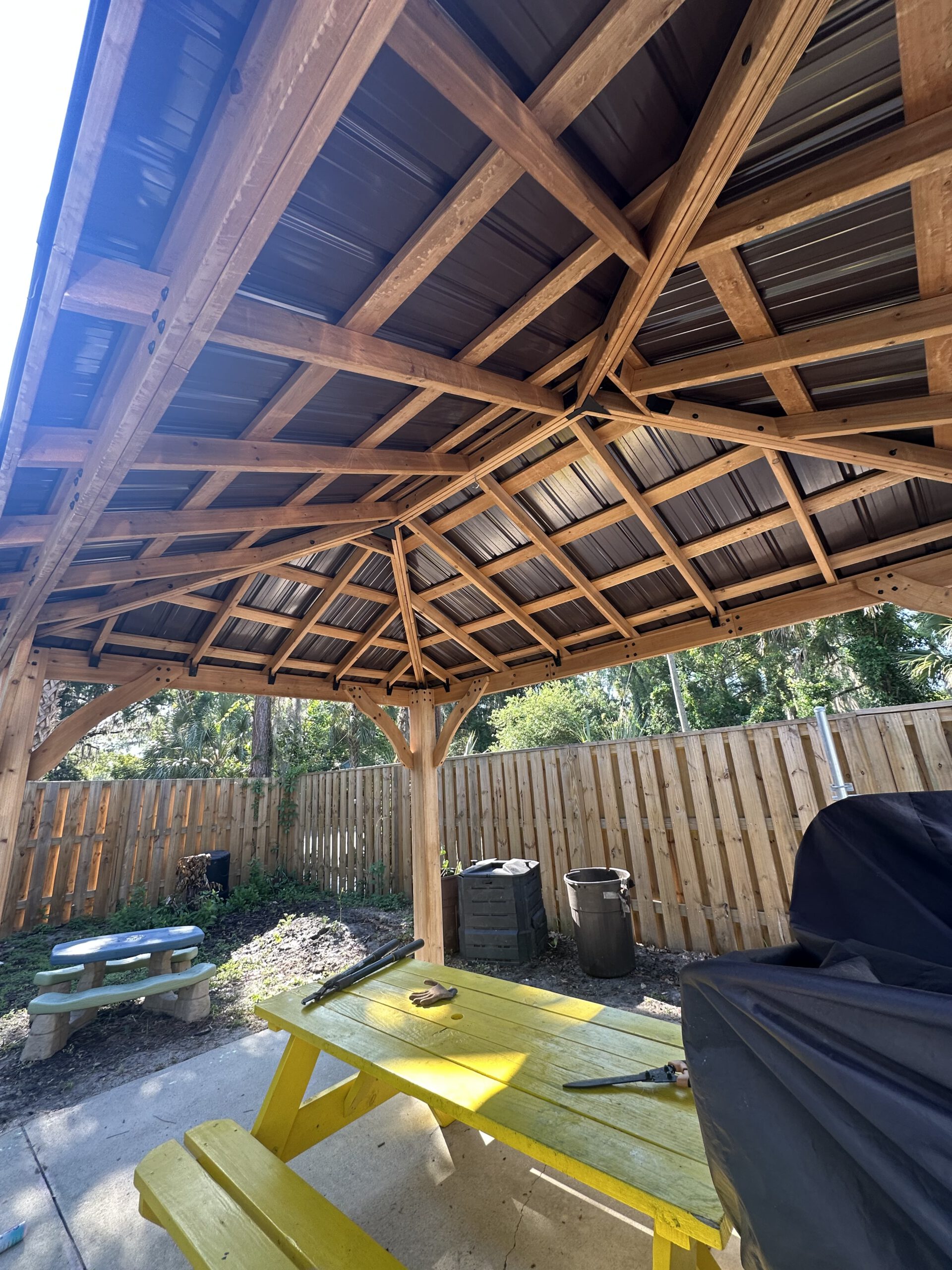 Backyard pavilion — stained & sealed by Color Pros Painting