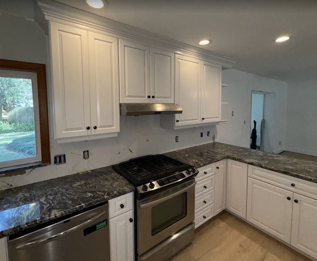 Cabinet refinishing — smooth factory finish by Color Pros Painting