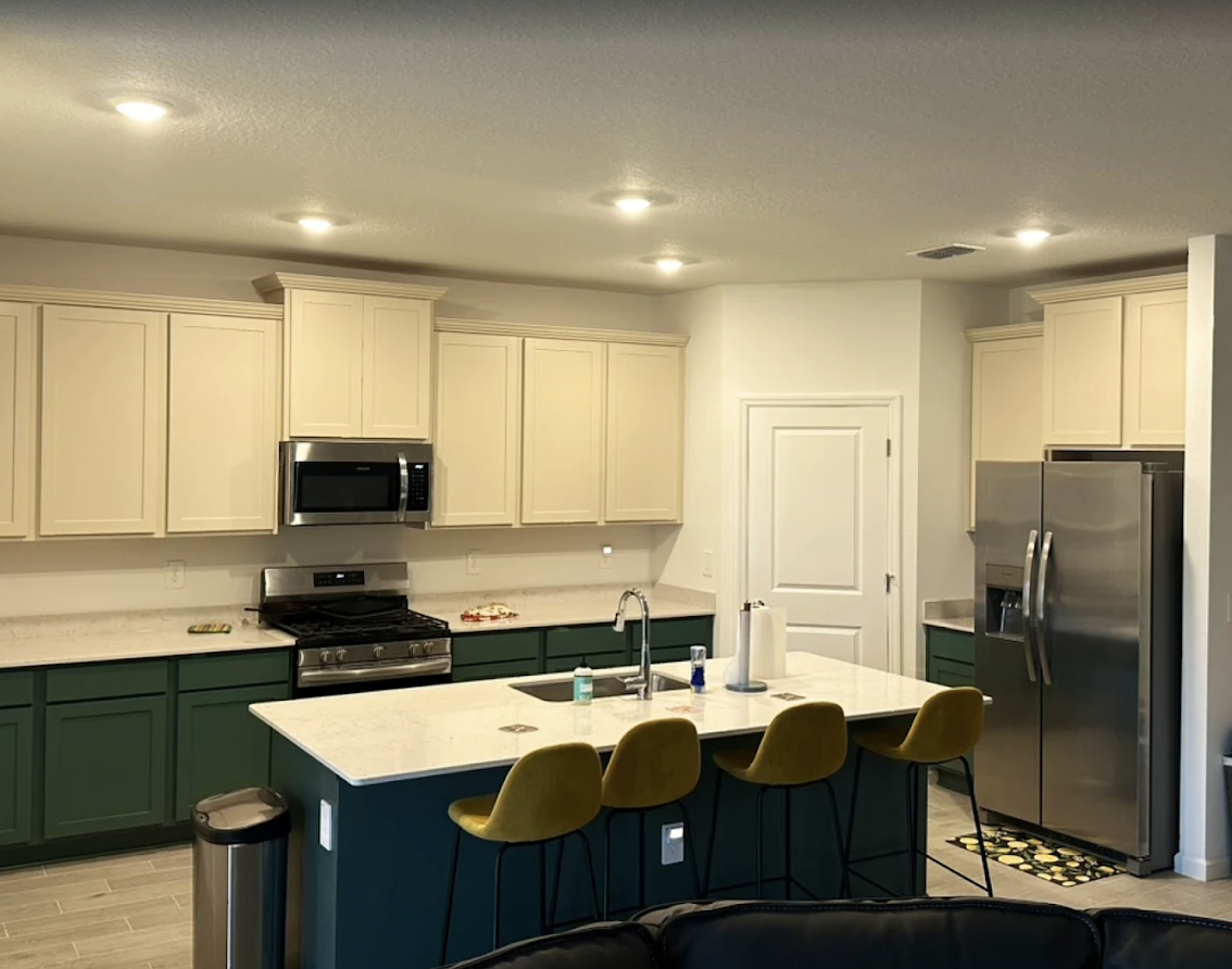 Kitchen refresh — cabinets painted bright white by Color Pros Painting